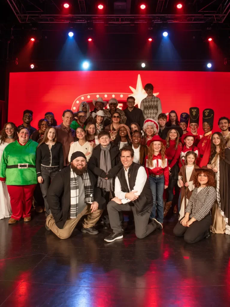 Festive Theater Cast Under Stage Lights